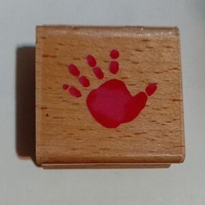 Wooden Stamper with Red Handprint Design
